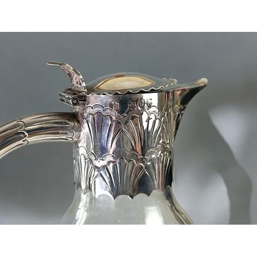 454 - Christopher Dresser style Edward Hutton silver mounted Claret jug.London, 1892 hallmarks.Stylised de... 