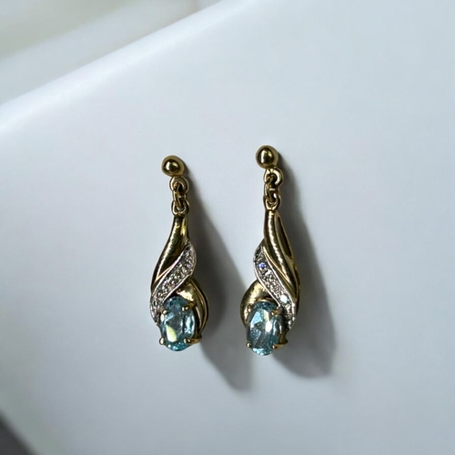 546 - A pair of ladies 9ct Gold, Aquamarine & Diamond earrings.Stamped 375 to verso.Length - 23mm... 