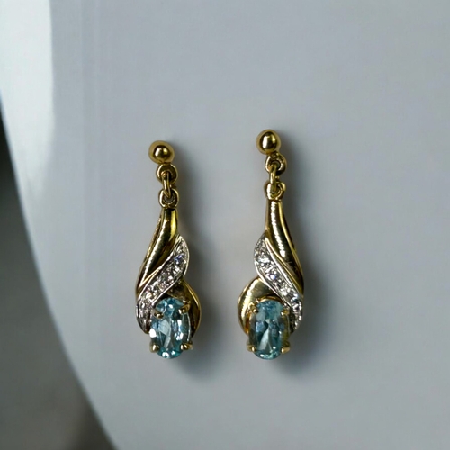 546 - A pair of ladies 9ct Gold, Aquamarine & Diamond earrings.Stamped 375 to verso.Length - 23mm... 