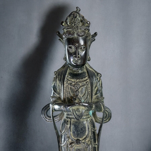 13 - A large Chinese Bronze figure of Guanyin.Qing dynasty.Robed Guanyin standing on tiered lotus base. D... 