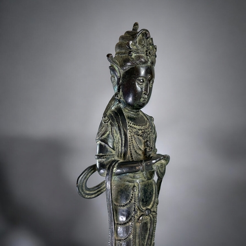 13 - A large Chinese Bronze figure of Guanyin.Qing dynasty.Robed Guanyin standing on tiered lotus base. D... 