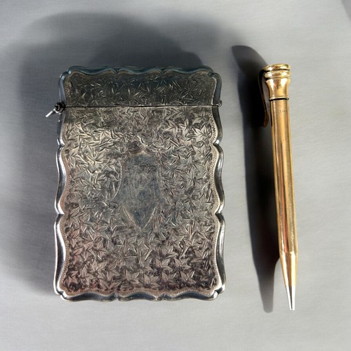 123 - A Victorian sterling Silver card case.Birmingham, 1896 hallmarks. Together with a gold filled Eversh... 