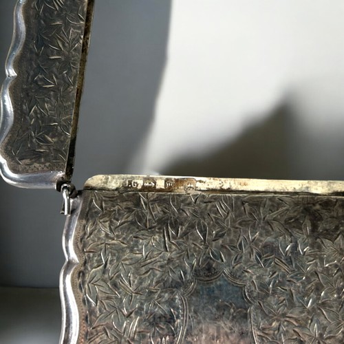 123 - A Victorian sterling Silver card case.Birmingham, 1896 hallmarks. Together with a gold filled Eversh... 