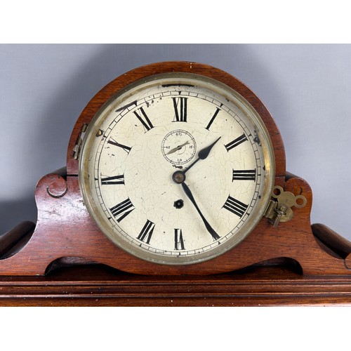 512 - A large Carved Oak frame napoleon shape mantle clock.19th century.Large enamel dial with black roman... 