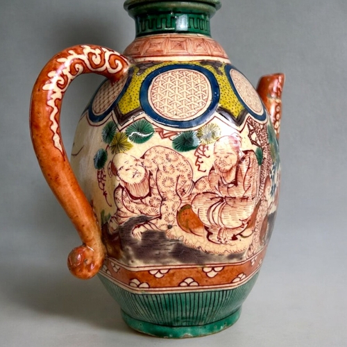 20 - A Japanese Banko ware wine ewer.Edo period, 19th century.Hand painted Scholars & young servant. ... 