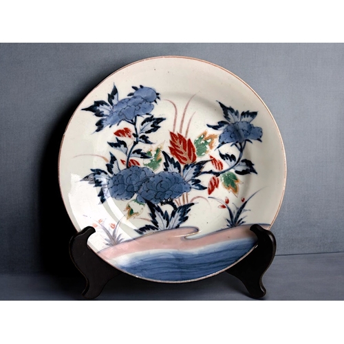 21 - A Japanese Nabeshima porcelain dish.Edo / Meiji period, 19th century.Underglaze blue, with polychrom... 