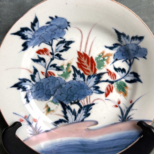 21 - A Japanese Nabeshima porcelain dish.Edo / Meiji period, 19th century.Underglaze blue, with polychrom... 