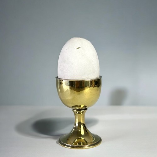 486 - A Silver gilt and enamel 'Surprise' egg.By Anthony Elson.London, 1979 hallmarks.White enamel egg lif... 