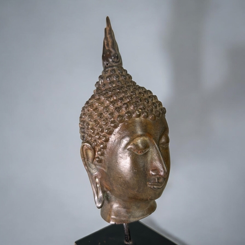 15 - A mounted Thai bronze Buddha head.In the Sukhothai kingdom style. Height - 24cm