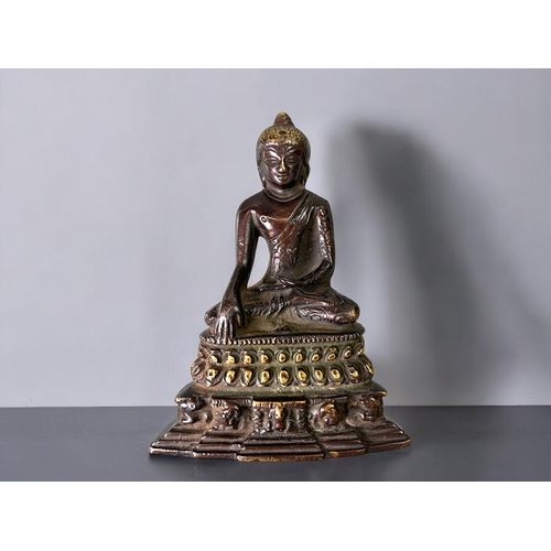 16 - A Tibetan bronze Buddha figure.Seated in vajrasana, sat on double lotus base. In the Pala style. Hei... 