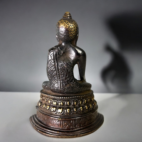 16 - A Tibetan bronze Buddha figure.Seated in vajrasana, sat on double lotus base. In the Pala style. Hei... 