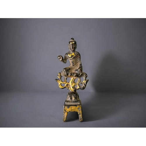 17 - A Chinese bronze statue of Buddha.In the Northern Wei style.Sat atop a flame with right hand raised ... 