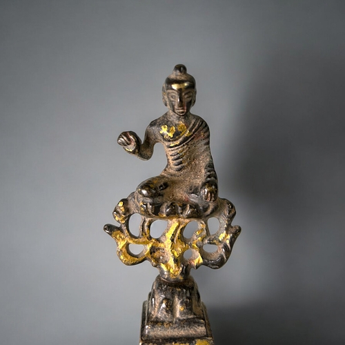 17 - A Chinese bronze statue of Buddha.In the Northern Wei style.Sat atop a flame with right hand raised ... 