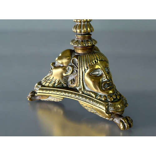 435 - A Grand Tour gilt bronze candlestick.France, 19th century.Sat on three winged Lion paw feet, with st... 