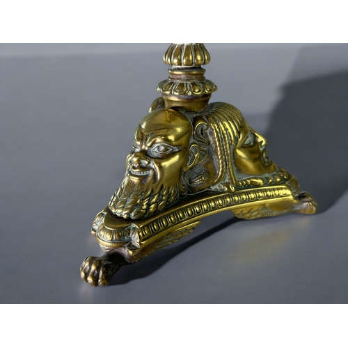 435 - A Grand Tour gilt bronze candlestick.France, 19th century.Sat on three winged Lion paw feet, with st... 