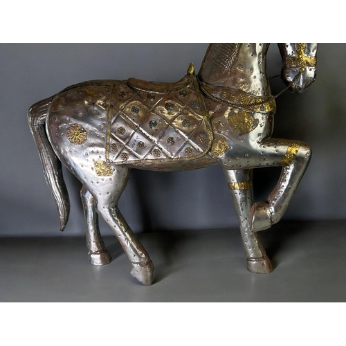 76 - A large Indian metal applique horses.Together with a small example.Larger - 50 x 45cm