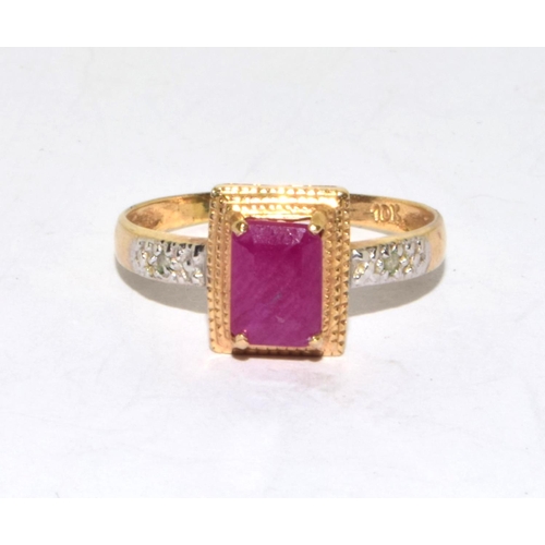 553 - 9ct gold ladies Ruby and Diamond Halo ring size O