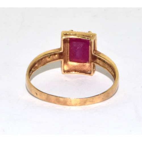 553 - 9ct gold ladies Ruby and Diamond Halo ring size O