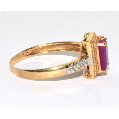 553 - 9ct gold ladies Ruby and Diamond Halo ring size O