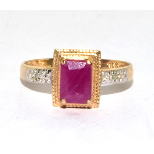 553 - 9ct gold ladies Ruby and Diamond Halo ring size O