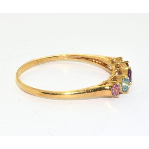 561 - 9ct gold ladies semi precious stone ring set with Ruby, Amber , Garnet Aquamarine, and Tourmaline si... 