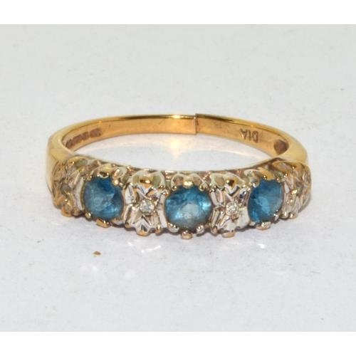 570 - 9ct gold ladies Diamond and Blue Topaz ring hallmarked as diamond in the ring size O