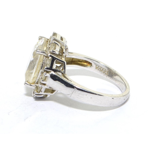 560 - 925 silver ladies statement ring with a large centre stone set with baguette cut outer rim size N