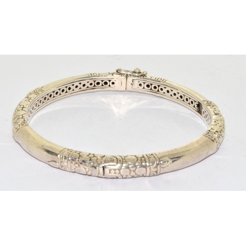 573 - 925 silver ladies solid bangle with spring clip catch and snake skin decoration