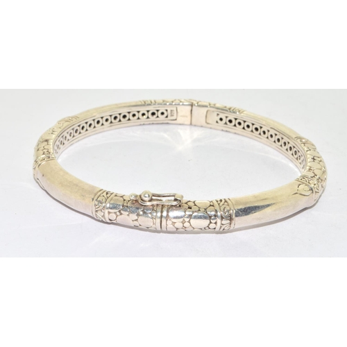 573 - 925 silver ladies solid bangle with spring clip catch and snake skin decoration