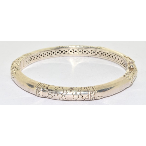 573 - 925 silver ladies solid bangle with spring clip catch and snake skin decoration