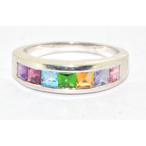 576 - 925 silver multi gem stone ring set in a chanel setting size N