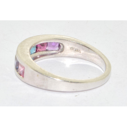 576 - 925 silver multi gem stone ring set in a chanel setting size N