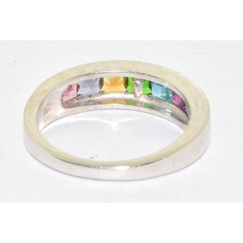 576 - 925 silver multi gem stone ring set in a chanel setting size N