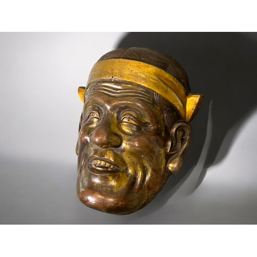 26 - A Japanese gilt metal Noh mask.Late Meiji period.Bronze & gilt patina.18 x 15.5cm... 