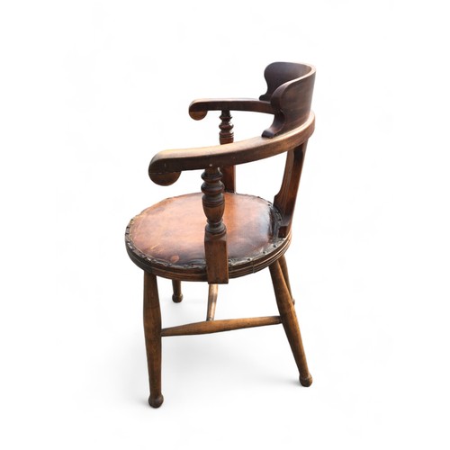 168 - Antique Beech Late 19th Century Smokers Bow Chair, having Leatherette and Studded upholstered circul... 