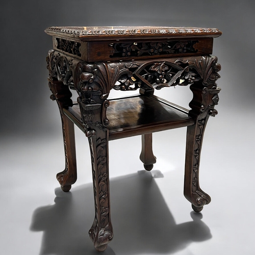 29 - A finely carved Chinese hardwood Plant stand / table.Qing dynasty, 19th century.Elaborately carved (... 