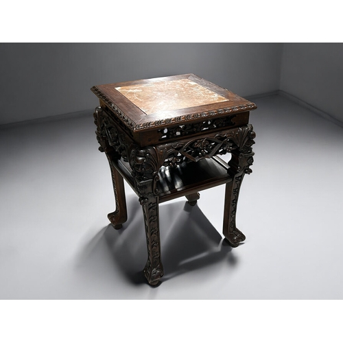 29 - A finely carved Chinese hardwood Plant stand / table.Qing dynasty, 19th century.Elaborately carved (... 