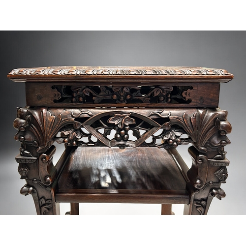 29 - A finely carved Chinese hardwood Plant stand / table.Qing dynasty, 19th century.Elaborately carved (... 