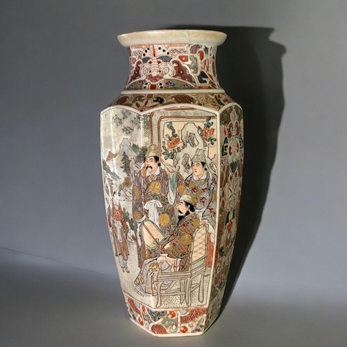 23 - A large Japanese Satsuma vase.Meiji period, 19th century.Hexagonal form, painted court scenes with s... 