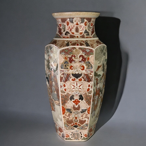 23 - A large Japanese Satsuma vase.Meiji period, 19th century.Hexagonal form, painted court scenes with s... 