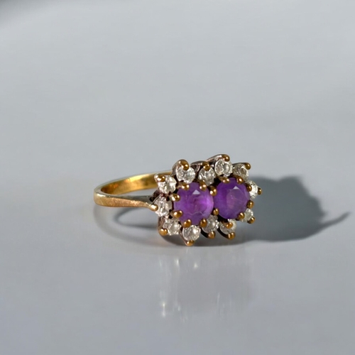 482 - A 9ct Gold & Amethyst set ladies ring.Two round cut Amethyst, surrounded with clear stones. Hall... 