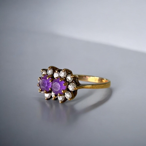 482 - A 9ct Gold & Amethyst set ladies ring.Two round cut Amethyst, surrounded with clear stones. Hall... 