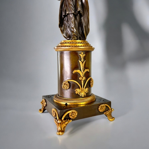 436 - A Charles X Gilt and Patinated bronze Chinoiserie candlestick.French, 1st quarter 19th century.Heigh... 