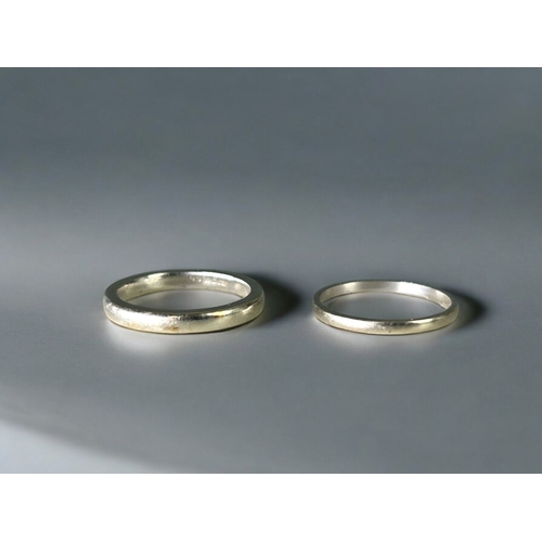 602 - Two 9ct white gold bands.Sizes L & M.Weight - 4.28g