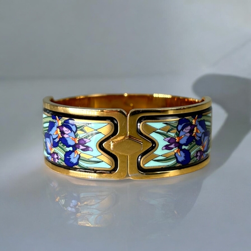 483 - Michaela Frey, Wein (Frey Wille).A polychrome enamelled, gold plated bangle.