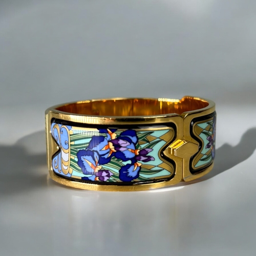 483 - Michaela Frey, Wein (Frey Wille).A polychrome enamelled, gold plated bangle.