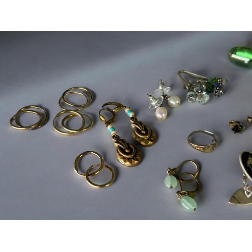 603 - A collection of ladies jewellery. To include white metal bangles, silver Neillo Siam cufflinks, earr... 