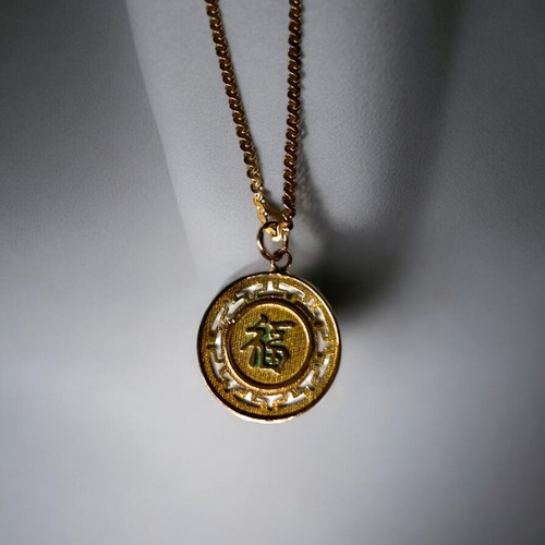 605 - A Chinese 14c gold pendant on 9c gold chain weight gross weight 6.3g