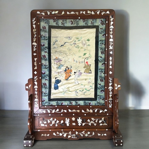 45 - A large Chinese Rosewood & mother-of-pearl inlaid screen.Fitted with Chinese silk embroidered pa... 