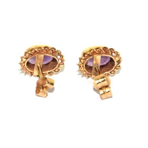 580 - 9ct gold vintage Amethyst stud earrings in a scroll setting